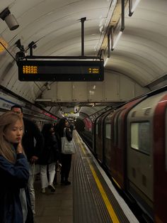 people are waiting for the subway to arrive