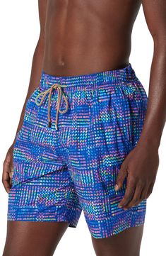 Bright and bold, these printed swim trunks made of lightweight, quick-drying fabric sport a roomy fit and plenty of pockets for essentials. Elastic/drawstring waist Side-seam pockets; back zip pocket with drainage grommets Mesh liner 100% polyester Machine wash, dry flat Imported Multicolor Swim Trunks With Built-in Shorts For Sports, Athleisure Swim Trunks With Pockets For Beach, Athleisure Swim Trunks With Drawstring For Sports, Athleisure Swimwear With Pockets For The Beach, Blue Swim Trunks With Side Pockets For Beach Season, Blue Swim Trunks With Side Pockets, Blue Nylon Go-dry Swim Trunks, Nylon Swimwear With Side Pockets, Blue Go-dry Swimwear For Beach Season