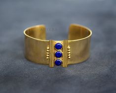 Handmade Minimal Cuff, Lapis Gemstone High Quality Bangle Bracelete, Mordern Adjustable Cuff, Party Wear Bangle For Anniversay Gift Description: *Metal: 18k Gold Filled Brass. *Gemstone:  7MM Round Lapis Lazuli Gemstone *Can be personalized, if you require.  Please note that all above details are accurate.  The beautiful jewels are created with the sole purpose of giving its owner a sense of freedom and enrichment. These can be gifts to your loved ones or to yourself. These can be used for heali Adjustable Cuff Bangle For Formal Occasions, Adjustable Brass Bangle For Formal Occasions, Adjustable Brass Bracelets For Formal Occasions, Formal Adjustable Brass Bangle, Adjustable Cuff Bracelet For Formal Occasions, Gold Cuff Beaded Bracelet As Gift, Handmade Brass Elegant Cuff Bracelet, Gold Cuff Beaded Bracelets For Gift, Handmade Elegant Brass Cuff Bracelet