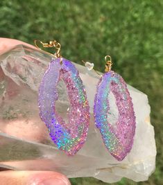 These pink holographic color shifting geode earrings are sure to get compliments or make an amazing one of a kind gift! They are mostly a clear  pink at a certain angle and then as soon as they shift they show a beautiful sparkly rainbow. They are lightweight-made with resin to ensure this- and won't bother your ears. Please choose whether you would like gold or silver earwires Clip on earrings are available as well For those who want all the sparkle but in a smaller geode stud, these are also a Holographic Color, Rainbow Sparkle, Pink Holographic, Geode Earrings, Gem Earrings, Boho Festival, Matching Necklaces, Resin Crafts, Cute Jewelry