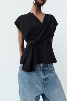 KNOTTED CREPE TOP - Black | ZARA United States Trendy V-neck Top With Twist Front, Modern V-neck Blouse For Spring, Modern V-neck Workwear Blouse, Modern V-neck Blouse For Work, Versatile V-neck Blouse For Night Out, Solid Color V-neck Faux Wrap Top, Modern V-neck Tops For Summer, Summer V-neck Twist Front Tops, Modern V-neck Top For Spring