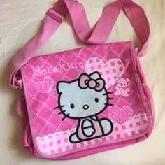 Brand By Hello Kitty Sanrio. Brand New, Just Bought It But No Tags. Can Be Great As A Kid's School Bag, Big Enough For Textbooks, You Can Even Put Water Bottle, Pencils, Etc. Or Travel Bag For Carrying Anything!! Has A Huge Back Pocket As Well For Additional Things. Super Convenient, Useful, And Adorable. Can Fit A 15 Inch Laptop Too On The Back Pocket! Measurements: L 12" X W 14" X H 3" Maximum Length Of Adjustable Strap: 21" Hello Kitty Messenger Bag, Cute Hello Kitty Print Bags For Back To School, Cute Hello Kitty Shoulder Bag For School, Cute Hello Kitty Print School Shoulder Bag, Hello Kitty Print School Shoulder Bag, Pink Hello Kitty Print Bag For Back To School, Trendy Hello Kitty Shoulder Bag For School, Pink Cat Design Shoulder Bag For School, Casual Pink Shoulder Bag With Cat Design