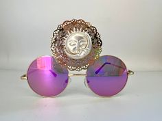 ❤️Third eye statement sunglasses by Alexis Exclusive - one of a kind design. ❤️This quirky pair of Third Eye Sunglasses are the perfect unusual accessory if you love something different. ❤️The three lenses are gold metal and they have silver pink mirrored lenses. In the centre lens they have a large gold ornate filigree with a silver sun and moon centre!  ❤️Great for festivals, carnivals, holidays, or everyday wear if that's your thing 😉 ❤️UV protection. ❤️Exclusive design made by myself, you w Gold Sunglasses For Summer Festival, Gold Round Frame Sunglasses For Party, Gold Round Frame Party Sunglasses, Festival Sunglasses With Mirrored Lenses And Round Frame, Gold Sunglasses With Gradient Lenses For Festivals, Round Frame Sunglasses With Mirrored Lenses For Festivals, Gold Tinted Sunglasses For Festival, Mirrored Lens Sunglasses For Festivals, Gold Tinted Sunglasses For Gift