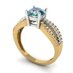 a yellow gold ring with a blue topazte and white diamonds