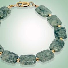 Crafted with a combination of rectangle shaped flat beads and gold-filled, this bracelet will make heads turn. Designed to make a statement, the Rania Bracelet will give you an effortless and classic look. Leaf green jade (13x10mm) Gold-filled beads and clasp Length: 7.5" Elegant Jade Bracelets With Polished Beads, Elegant Green Rectangular Bracelet, Green Rectangular Bracelet For Formal Occasions, Green Rectangular Bracelets For Formal Occasions, Elegant Rectangular Polished Beads Jewelry, Elegant Rectangular Gemstone Beads Jewelry, Green Rectangular Gemstone Beads Jewelry, Formal Green Rectangular Bracelets, Formal Green Rectangular Bracelet