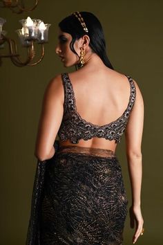 Black lace saree featuring embroidered floral motifs highlighted by sequin embellishments. Comes with matching padded sequin embellished blouse and a petticoat. - Aza Fashions Elegant Lace Work Pre-draped Saree For Reception, Elegant Pre-draped Saree With Lace Work For Reception, Elegant Pre-draped Saree With Lace Work, Elegant Fitted Pre-draped Saree With Lace Work, Elegant Sleeveless Pre-draped Saree With Resham Embroidery, Festive Evening Lace Sets, Party Wear Fitted Pre-draped Saree With Lace Work, Sleeveless Saree For Diwali Evening, Fitted Lace Work Pre-draped Saree For Party