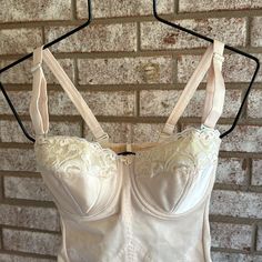 Old Unworn Stock From A Huge Private Collection No Smoke Or Pets Color Is Beige/ Tan . Not White. Not Peach . It Measures 18” From Center Bust To Snap In Crotch, Straps Are Removable. Bra Is Underwire Hooks Are Metal Bra Is Padded Fitted Bra With Lace Trim And Sweetheart Neckline, Fitted Underbust Bra Partially Lined, Fitted Bra With Boned Bodice, Fitted Pink Bra For Wedding, Fitted Full Cup Bra With Lined Body, Feminine Fitted Camisole Bra, Fitted Lace Trim Bra For Wedding, Wedding Underbust Fitted Bra, Fitted Bra-friendly Camisole In Coquette Style