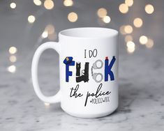 a white coffee mug that says i do fluk the police