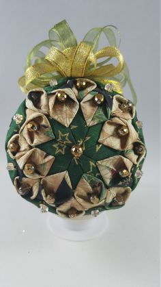 an ornament with bells and bows on it