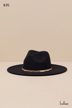 Western wear just got a little more chic, thanks to the Cowgirl Composure Black Felt Metal Band Western Hat! This iconic hat has a soft, felt composition that shapes the recognizable cowboy silhouette of a wide brim, a high collar, and a classic dipped crown. Gold-toned herringbone chain creates a chic braided band to complete the look. 3. 75" Soft Brim. 23" Interior Circumference. 90% Polyester, 10% Alloy. Imported. Lulus | Cowgirl Composure Black Felt Metal Band Western Hat. Chic Fedora Felt Hat For Party, Fall Party Felt Hat With Short Brim, Wide Brim Felt Hat For Party, Wide Brim Felt Hat For Parties, Fall Felt Hat For Country Events, Chic Winter Party Felt Hat, Chic Fedora With Flat Brim For Rodeo, Black Felt Hat For Fall Party, Black Felt Hat For Party In Fall