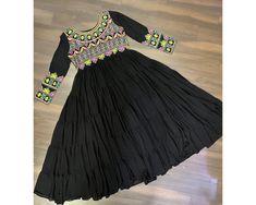 Exclusive Black Anarkali Gown Full Flair gown 15 mtr Flair Navratri Gown 5 frill Gown Partywear gown Readymade Black Gown Gamthi Garba Gown  NAVRATRI COLLECTIONS-2024  Gown :-   Fabrics & Work :- Faux Blooming  Fabric with Kutchi Gamthi Work  Size :- L Size (40 Inch Stitched) {User can adjust From 38" to 44" for your body comfort)}  Stitching :-  5 Layers Gathering Stitching   Length :- 55 Inch  Flair :- 15 Meter  Sleeves :- Full Sleeves  Neck :- Fancy Front and back neck   Lining(Inner) :- Cott Semi-stitched Black Gown For Eid, Black Semi-stitched Traditional Gown, Black Traditional Semi-stitched Gown, Traditional Black Maxi Length Gown, Traditional Black Maxi Dress For Festive Occasions, Black Georgette Dress For Festivals, Black Floor-length Gown For Diwali, Black Georgette Anarkali Set For Navratri, Black Gown For Eid Party