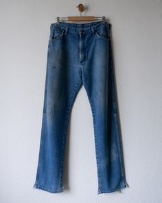 90s Vintage Wrangler Jeans Paint Distressed Made In USA 🔍 Key Features: * Wrangler Jeans * Made in the USA, 90s era, medium wash, worn in distressed look 📝 Condition: * Sold as is; has worn in look, paint stains and markings all throughout, bottom hem splits 📏 Measurements: * Waist: 17 in * Inseam: 33 in * Leg Open: 9.5 in * Thigh: 12.5 in ✨ Additional Info: * Cleaned & ready to wear right out of the box! 🧼 * Open to offers. Got questions? I'm here to help! 📬 Vintage Jeans Medium Wash With Frayed Hem, Vintage Jeans With Medium Wash And Frayed Hem, Vintage Medium Wash Jeans With Frayed Hem, 90s Style Distressed Dark Wash Jeans, 90s Style Distressed Denim Blue Jeans, 90s Distressed Denim Blue Jeans, 90s Distressed Dark Wash Jeans, 90s Style Distressed Cotton Jeans, 90s Distressed Cotton Jeans