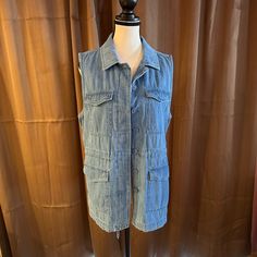 This Ann Taylor Loft Denim Vest Has It All. Four Pockets Drawstring At The Waist To Loosen Or To Gather, Buttons Down The Front That You Can Partially Button Or Leave All The Way Open. This Is Such A Great Piece! Check Out The White Denim Piece Listed If Not Already Gone! Casual Washed Blue Denim Vest With Pockets, Casual Denim Vest With Pockets For Workwear, Casual Button-up Denim Vest With Pockets, Relaxed Fit Denim Vest With Pockets, Dark Wash Chambray Denim Jacket For Fall, Utility Cotton Denim Vest For Summer, Spring Button-up Denim Vest With Pockets, Summer Utility Cotton Denim Vest, Summer Utility Style Cotton Denim Vest