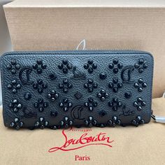 Zip Wallet Christian Louboutin Panettone Black Leather Zip Spiked Wallet Brand New In Box, Full Inclusions 100% Authentic. A Zip-Around Wallet In Grainy Calfskin Leather Is Embellished With A Striking Array Of Mixed-Metal Studs And Metallic Logo Emblems. Zip-Around Closure Interior Zip, Wall And Smartphone Pockets; 12 Card Slots Signature Red Leather Lining Calfskin Leather Made In Italy Designer Handbags Condition: Brand New, Never Worn And Comes With The Original Box, Dust Bag, All Insert Pape Designer Leather Clutch Wallet, Black Clutch Wallet For Evening, High-end Black Wallet For Formal Occasions, Black Evening Clutch Wallet, Designer Black Clutch Wallet, Designer Black Wallet For Formal Occasions, Luxury Bifold Evening Wallet, Designer Leather Clutch With Card Slots, Designer Bifold Clutch For Evening