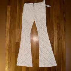 White Lace Beach Pants Size Large Shorts Inside New With Tags Never Worn White Non-stretch Pants For Beach, Mid-rise Summer Beach Pants, Mid-rise Pants For Beach In Summer, Mid-rise Pants For Summer Day Out, Summer Stretch White Pants, Trendy White Beach Pants, Fitted White Beach Pants, Spring Vacation Stretch Bottoms, Fitted White Pants For Beach Season