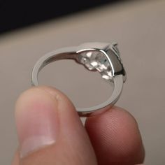 This is a gorgeous handmade creation. Its beauty is its simplicity & Elegance. The 6*6 mm heart cut faceted natural Aquamarine is crafted in solid sterling silver and with rhodium plated. All item is sent in a beautiful gift box If you have any idea of design your ring,pls contact me directly. You can realize more lovely stuff clicking the link https://www.etsy.com/shop/knightjewelry?refshopsection_shophome_leftnav Please leave the correct address and you phone number for delivering successf Elegant Heart-shaped Topaz Gemstone Ring, Elegant Heart Shaped Topaz Gemstone Ring, Moissanite Heart Ring For Promise, Heart Cut Blue Topaz Rings For Anniversary, Heart Cut Blue Topaz Promise Ring, Heart Ring With Center Stone For Promise, Round Cut, Moissanite Heart Promise Ring, Moissanite Heart Ring With Prong Setting As Gift, Moissanite Heart Ring With Round Cut For Gifting