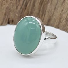 Aqua Chalcedony Ring Discover the enchanting allure of the Aqua Chalcedony Ring, a beautifully handcrafted piece that exudes understated elegance. This ring features a captivating blue chalcedony gemstone, renowned for its soothing hue and gentle, translucent quality. Key Features:     Gemstone: Aqua Chalcedony - Known for its calming, serene blue color, this gemstone brings a touch of tranquility and sophistication to any look.     Material: 925 Sterling Silver - The band is made from high-qual Silver Ring Simple, Aqua Chalcedony Ring, Blue Gemstone Ring, Blue Gemstone Rings, Chalcedony Ring, Simple Ring, Aqua Chalcedony, Ring Simple, Ring Blue