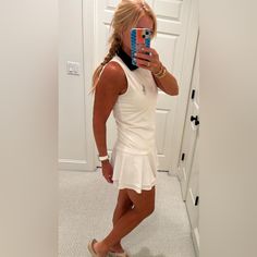 This Is A New With Tags Never Worn White Tennis Dress By Ralph Lauren In Size Small. It Has A Large Silver Embroidered Polo Pony, Navy Collar And Tiered Layered At The Bottom. I Am Shown Modeling It. I Am 5’7”. I Am Cleaning Out My Closet. Smoke Free Home. Please Ask Any Questions & Thank You! White Tennis Dress, Us Open Tennis, Polo Pony, Lauren White, Ralph Lauren Dress, Us Open, Tennis Dress, Tennis, Ralph Lauren