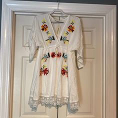 Nwt Women’s Impressions Embroidered Babydoll Dress Size Large. Never Worn. Comes From Pet Free/Smoke Free Home. White V-neck Dress With Floral Embroidery, Embroidered Cotton Mini Dress For Vacation, White Floral Applique Mini Dress For Spring, White Mini Dress With Floral Applique For Spring, Cute Multicolor Embroidered Spring Dress, Cute Multicolor Embroidery Spring Dresses, Embroidered White Long Sleeve Mini Dress, White Long Sleeve Embroidered Mini Dress, White Embroidered Long Sleeve Mini Dress