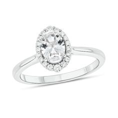 Display your lasting love for her in the most sophisticated way with this classic oval-shaped white lab-created sapphire and diamond frame engagement ring in white gold. Fashioned in cool 10K white gold This choice showcases a 7.0 x 5.0mm oval-shaped shimmering white lab-created sapphire. Graduated-size diamonds - the largest stones at the top and bottom - surround the center stone in a sparkling frame. This engagement ring shines with 1/6 ct. t.w. of diamonds. Love For Her, Diamond Frame, White Lab, Lasting Love, Green Diamond, 14k White Gold Ring, Halo Diamond Engagement Ring, Gemstone Engagement Rings, Diamond Clarity