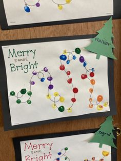 two christmas cards with the words merry and bright written on them, hanging from a bulletin board