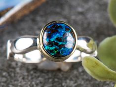 Thank you for visiting 3 Kings Opals. Boulder Opal, 925 Silver and 14ct Gold. The size of the ring is size US  Face dimensions: Length:       08mm  rounded Hi, We Hope you're having a great day!  This ring is part of our new 'gold bezel with silver band' line. The design keeps with our minimalist roots and also just adds a touch of class. The effect you get is mesmerising. The 14ct gold bezel makes the natural solid boulder opals colours pop out and grab you. As well as keeping the price down; t Sterling Silver Yellow Gold Opal Ring, Sterling Silver Opal Ring In Yellow Gold, Yellow Gold Sterling Silver Opal Ring, Polished Opal Ring For Anniversary, Polished Finish Opal Ring For Anniversary, Sterling Silver Opal Ring With Polished Finish, Sterling Silver Round Solitaire Opal Ring, Polished Opal Promise Ring, Sterling Silver Opal Fine Jewelry Ring