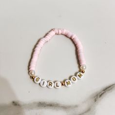 Discover our enchanting Pink Beaded Girl Mom Bracelet, a heartfelt expression of the bond between mother and daughter. This meticulously handcrafted piece features a delightful blend of pink beads that symbolize love, tenderness, and nurturing. Each bead is carefully chosen and strung together to create a stunning accessory that resonates with the essence of motherhood. 🍼Wear this bracelet proudly as a symbol of the strong, unbreakable bond between you and your daughter. Whether you're celebrating a special occasion or simply want to carry a piece of your heart with you, this bracelet is a perfect choice.  ✨Embrace the love and joy of motherhood with this exquisite accessory - order yours today and celebrate the cherished connection you share with your daughter. Cute Mother's Day Jewelry With Letter Beads, Pink Custom Name Friendship Bracelets For Mother's Day, Custom Name Pink Friendship Bracelets For Mother's Day, Handmade Pink Name Bracelet For Mother's Day, Customizable Pink Bracelets For Mother's Day, Customized Pink Friendship Bracelets For Mother's Day, Customizable Pink Bracelet For Mother's Day, Gift Beaded Bracelets With Letter Beads, Pink Letter Beads Name Bracelet