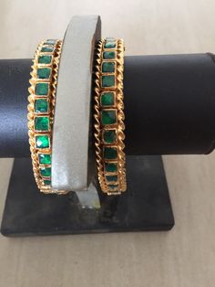 *This is Gold Finish Kundan Bangles Pair.Its Perfect for Wedding Occasion as well as Unique and Ethnic Traditional Bangle to gift and Also Bridal wear to match with Wedding Outfits. *Its made from Silver n Copper mix material and 100% Handmade. *Its available in Various Sizes like 2,2.2,2.4,2.6 Etc *Its open able Screwed Bangles Pair. *All Kundan stones set with silver foils handsetting method and long last guarantee of its workmanship.It is White Kundan Stones like pictures. *Also Available in Hand Set Green Jewelry For Wedding, Green Bracelet Jewelry For Wedding, Green Wedding Bracelet Jewelry, Traditional Green Bridal Sets For Formal Occasion, Wedding Jeweled Bangle, Green Hand Set Jewelry For Marriage, Green Hand-set Jewelry For Marriage, Traditional Jeweled Bracelets For Parties, Handmade Gold Bridal Sets For Wedding