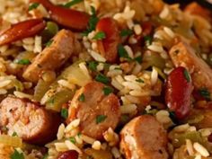 rice with sausage and peppers in a pan