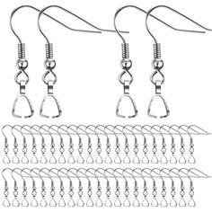 several pairs of earrings hanging from hooks