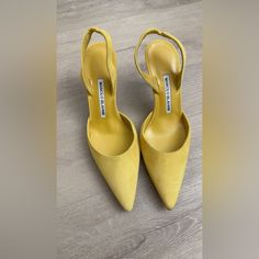 Add A Pop Of Color To Your Wardrobe With These Stunning Manolo Blahnik Yellow Suede Heels, Handmade In Italy. These Iconic Shoes Combine Style, Comfort, And Luxury. Condition: Excellent, Gently Worn (See Images For Details) Size: 36 ½ (Eu) Color: Vibrant Yellow Suede Material: Premium Suede Upper With Leather Insole And Outsole Features: Pointed Toe For A Sleek, Modern Look Elegant Slingback Strap For A Secure Fit Signature Manolo Blahnik Craftsmanship These Chic Heels Are Perfect For Special Oc Formal Yellow Heels With Sculpted Heel, Yellow Fitted Heels For Formal Occasions, Formal Yellow Heels With Heel Strap, Elegant Yellow Pointed Toe Heels, Elegant Yellow Heels For Cocktail, Elegant Yellow Cocktail Heels, Elegant Yellow Slingback Pumps With Pointed Toe, Formal Yellow Heels With Wrapped Heel, Elegant Yellow Closed Toe Heels