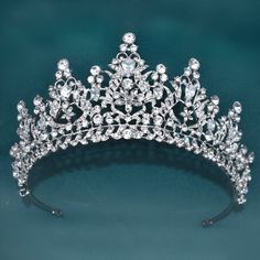 Elevate your special occasion look with this exquisite collection of Women's Opulent Crystal Crowns. Perfect for weddings, proms, or any glamorous event, these stunning accessories are designed to make you feel like royalty.Each crown and tiara is meticulously crafted with shimmering crystals and intricate details, adding a touch of elegance and sophistication to any outfit.Whether you're the bride, a bridesmaid, or just a queen in your own right, these opulent crowns and tiaras will surely make Crown And Tiara, Crowns And Tiaras, Crystal Crowns, Crystal Crown Tiaras, Bride Hair Jewelry, Bridal Headwear, Bridal Headdress, Bride Headpiece, Queen Crown