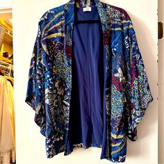 Nwot Zara Trafaluc Floral Kimono Style Robe Jacket Beach Coverup Boho Sweater Fun Kimono Style Robe To Wear As A Beach Coverup Or With A Cami And Jeans For A Night Out. Never Worn That I Remembersigh! Size M Outer Shell Is A Gorgeous Navy Floral. Inside Is Lined A A Navy Blend So This Piece Has Substance And Structure. Excellent Condition! Got Questions? Send A Message. Thanks For Visiting My Closet. Silk Long Sleeve Summer Outerwear, Blue Floral Print Outerwear For Vacation, Zara Long Sleeve Kimono For Vacation, Zara Long-sleeve Kimono For Vacation, Zara Bohemian Long Sleeve Kimono, Blue Tops With Kimono Sleeves For Vacation, Blue Floral Print Kimono For Fall, Blue Floral Print Summer Outerwear, Zara Multicolor Summer Kimono