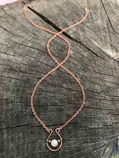 This rustic, dainty pendant is hand crafted from organic copper and features a lovely, genuine freshwater pearl.  This necklace is charming and would be perfect worn alone or layered with longer necklaces for a boho style. Copper is the traditional gift for the 7th Anniversary. Pearl is the birthstone for the month of June. All jewelry from my studio will arrive attractively packaged and ready for gifting or keeps. MEASUREMENTS & SPECIFICS:CHAIN: 22" copper cable chain w/ hand forged hook cl Rose Gold Copper Wire Necklace For Gift, Simple Hand Forged Jewelry For Gifts, Simple Hand Forged Jewelry For Gift, Simple Hand Forged Jewelry As Gift, Rose Gold Copper Wire Necklace Gift, Dainty Hand Forged Necklace For Everyday, Dainty Rose Gold Wire Wrapped Necklaces, Handmade Rose Gold Teardrop Necklace, Hand Forged Copper Necklace In Rose Gold