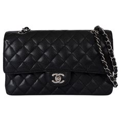 This 100% authentic Chanel Classic Medium 11.12 double flap shoulder bag is crafted from black quilted caviar leather with silver-tone hardware. It features an exterior open pocket on the back and a classic double chain strap with leather interweaving. The bag opens with the iconic CC twist lock followed by a second flap with a snap button closure. The exterior flap features a discreet zip pocket, traditionally known for storing love letters. The interior is lined with black leather and features a lipstick pocket and two open pockets on the back, offering both elegance and functionality. Has been carried and shows faint scratches on the inner flap and the lining. Overall in excellent condition. Measurements Model REV A01112 Y01864 C3906 Height 15cm (5.9in) Width 25.5cm (9.9in) Depth 6.5cm Classic Textured Leather Flap Bag, Classic Bags With Double Flap And Silver-tone Hardware, Luxury Bag With Silver-tone Hardware And Double Flap, Luxury Bags With Silver-tone Hardware And Double Flap, Luxury Double Flap Bag With Silver-tone Hardware, Business Bags With Silver-tone Hardware And Double Flap, Classic Bags With Palladium Hardware And Double Flap, Classic Bag With Palladium Hardware And Double Flap, Classic Shoulder Bag With Double Flap And Palladium Hardware