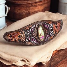 an ornate wooden object sitting on top of a table