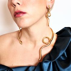 Model : Twisted Single Loose snake necklace Collection: Ofis Metal of Construction: BRASS (or Silver or Gold - upon your instructions) Effect: Gold-plated with lustrous effect Handcrafted in Greece Slightly adjustable size - open for your convenience ++ 2 pcs GOLD-PLATED with Lustrous effect available for immediate dispatch++ The design can also be constructed in gold 14K or 18K (either platinum) ONLY upon request... Price will be advised.- For any questions/inquiries please do not hesitate to a Gold Snake Shape Jewelry For Parties, Elegant Adjustable Snake Shape Necklaces, Elegant Gold Plated Snake Shape Necklace, Handmade Elegant Snake Chain Jewelry, Elegant Adjustable Snake Shape Necklace, Unique Gold Necklace With Adjustable Chain, Elegant Gold-tone Snake Shaped Jewelry, Party Jewelry With Brass Plating, Gold-plated Snake Shape Jewelry