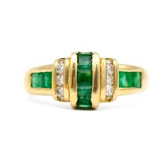 18k yellow gold ring with genuine emeralds and diamonds This ring features 9 princess cut emeralds, measuring approximately 2.5mm each. Two emeralds are chipped, one in the center and one on the side. The ring also has 10 round brilliant cut diamonds, measuring 1.5mm each. The diamonds have a total carat weight of 0.20 carat (J-K color SI clarity). Ring weighs 5.6 grams Ring size 7 Emerald Diamond Ring, 18k Yellow Gold Ring, Yellow Gold Ring, Multi Stone Ring, Emerald Diamond, Multi Stone, Round Brilliant Cut Diamond, Womens Jewelry Rings, Stone Rings