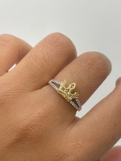 2D Crown Ring  -white CZ stones  -solid yellow gold crown  - available in size 7  -100% solid 14k gold  -will not tarnish, nor change color  -24/7/365 wearable  -sizing upon request. Ring are all final sales. -any questions please let us know  -item is sold by piece. Weight is undetermined. Gold Crown-shaped Diamond Ring, Luxury Yellow Gold Rings With Crown Design, Luxury Gold Rings With Crown Design, Gold Diamond Ring With Crown Design, Gold Crown Shaped Diamond Ring, Yellow Gold Diamond Crown Ring, White Gold Crown Ring With Prong Setting, Gold Cubic Zirconia Crown Ring, Cubic Zirconia Diamond Ring With Crown Design