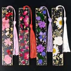 PRICES MAY VARY. 💮Meet your needs💮 You will get 4 styles of dried flower bookmarks, each style has different colors and kinds of flowers, and each bookmark has a tassel pendant of the same color; the rich quantity can meet your diverse needs, You can share with your friends and family 💮Suitable size💮 Each resin flower bookmark measures approx. 1 x 5.5 inch, proper size for you to use, lightweight and easy to store and carry 💮High-quality material💮 These dried flower bookmark are made of hi Dried Flower Bookmarks, Kinds Of Flowers, Beautiful Bookmarks, Homemade Bookmarks, Flower Bookmarks, Page Markers, Tassel Bookmark, Flower Bookmark, Transparent Resin