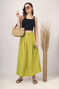 Apple Green Pleated Maxi skirt for women skirt, Long skirt, Custom made, Made to order, Plus size -Model height: 5'5" wearing size S -Length: 33" -Fit: A-line -Closure: Front button and zipper Green Full Skirt For Summer, Green Cotton Maxi Skirt, Green Wide-leg Lined Maxi Skirt, Green Wide Leg Lined Maxi Skirt, Green High Waist Flowy Skirt, Green High Waist Skirt, Green Maxi Skirt With Pockets For Summer, Flowy High-waisted Green Maxi Skirt, Green Gathered Long Skirt