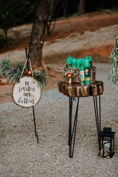 a sign that says it's winter bitterer next to two tables with drinks on them