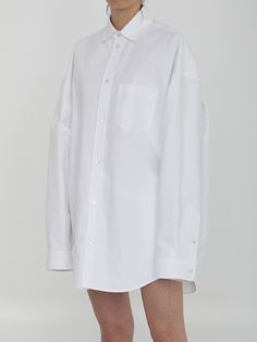 Outerwear shirt in white cotton poplin. It features classic collar, front press-stud closure, one patch pocket on chest, press-stud cuffs and curved hem. Large fit. Size nationality: US Product number: 134044 Product code: 794462TQM309140 Composition: 100% cotton Swedish Street Style, Balenciaga Shoes, Oversized Style, Box Pleats, Online Tops, Bold Fashion, Fashion Labels, Oversized Shirt, Shop Blouses