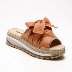 Reach New Heights With These Super Stacked Sandals, Featuring Espadrille Detailing And Sweet Ribbon Laces For An Ultra-Femme Touch. Features: Slip-On Style, Slingback Design, Round Open Toe, Suede Toe Strap, Triple-Stacked Platform Sole, Espadrille Detailing, Clear Midsole, Tread Outsole, Oversized Ribbon Laces, Self-Tie Slingback Strap Why We <3 It: These Super Unique Sandals Combine Femme And Sporty Style For A Totally Stand Out Pair. Fp Collection: Artisan Crafted From Fine Leathers And Premi Beach Slip-on Wedge Sandals With Leather Sole, Slip-on Wedge Sandals With Leather Sole For Beach, Orange Sandals With Rubber Sole For Spring, Leather Sole Slip-on Wedge Sandals For Beach, Spring Orange Sandals With Rubber Sole, Orange Leather Wedge Sandals For Beach, Beach Wedge Sandals With Leather Sole And Round Toe, Beach Wedge Sandals With Open Heel And Rubber Sole, Open Heel Wedge Sandals With Rubber Sole For Beach