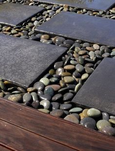 a screen shot of a website page with rocks and stones on the bottom right hand corner