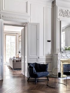 a living room filled with furniture and a fire place