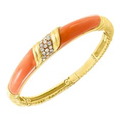 A spectacular jewelry piece. This exceptional and very reasonable in price Bangle bracelet It has two large pieces of natural pink Coral and approximately 0.80 ct. brilliant diamonds The Bangle bracelet is expertly crafted with 23 grams of 18 Karat Yellow Gold . Please look at the all the pictures to get a better idea. I have added pictures from my I phone too just to get a real feel of the piece. Authenticity and money back is guaranteed. All our jewelry comes with a certificate appraisal and m Elegant Luxury Coral Bracelet, Gold Woven Bracelet, Bezel Set Cabochon, Silver Snake Bracelet, Modern Bangle, Gold Bangle Set, Retro Bracelet, Yellow Gold Bangle, Diamond Bangles Bracelet