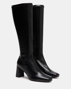 A half-zipper closure gives the HOLLY knee boot a calf-defining fit while an angled block heel and a square toe giving this style a sharp finish. Square toe block heel knee boot Side half zipper closure Angled block heel 2.75 inch heel height Size 6 measurements: 12 inch shaft circumference, 14.25 inch shaft height Size 8 measurements: 14.5 inch shaft circumference, 15.5 inch shaft circumference Size 10 measurements: 15 inch shaft circumference, 16 inch shaft height Vegan leather upper material Kitten Heel Slingbacks, Steve Madden Store, Wedge Loafers, Black Knee High Boots, Exclusive Shoes, Holly Black, Leather Socks, Knee Boot, Black Knees