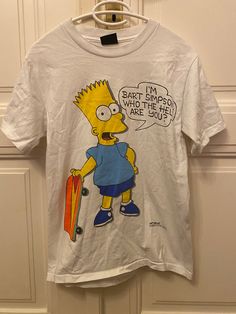 "Cool 1989 Vintage Bart Simpson shirt. Says: \"I'm Bart Simpson. Who the hell are you?\" Inside tag says \"Changes\", size: S fits like a small medium I would say.  length shoulder to bottom lying down flat: approx. 62cm.  width lying flat approx. 43cm sleeve width lying down flat: approx. 17cm please write to me if you need more in depth measurements or photos to make a decision.  MATERIAL: cotton CONDITION: good condition, print got some scuffs in the black parts mainly, see photos and let me Casual Graphic Design Shirt For Conventions, Casual Shirt With Letter Print For Fan Conventions, Bart Simpson Writing On Board, Bart Simpson Skateboarding, Bart Simpson Hoodie, Beavis And Butthead Shirt, Bart Simpson T Shirt, Simpsons Shirt, Make A Decision