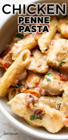 chicken penne pasta in a white bowl